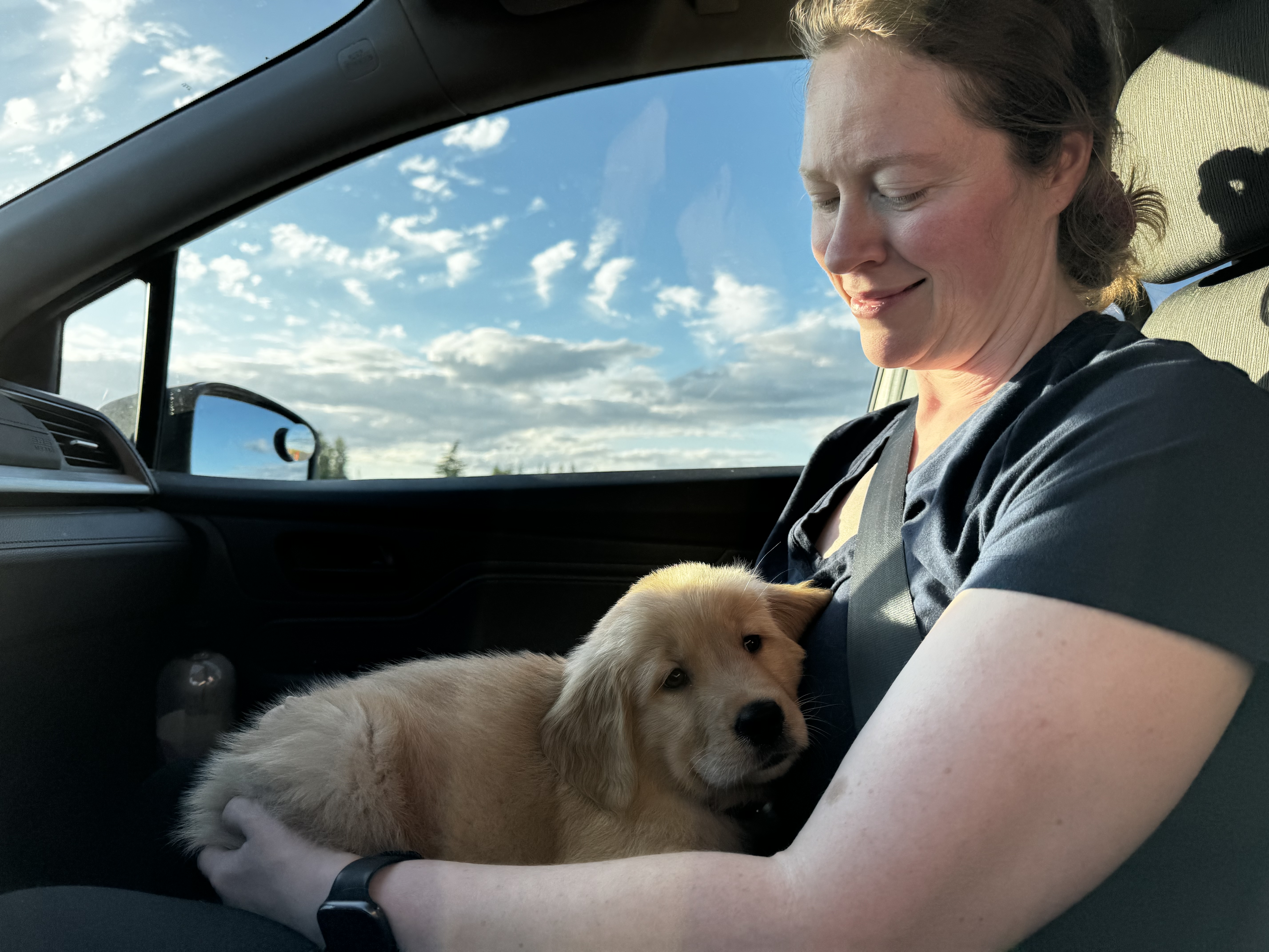 Young Cordelia riding in the car on her mother's lap